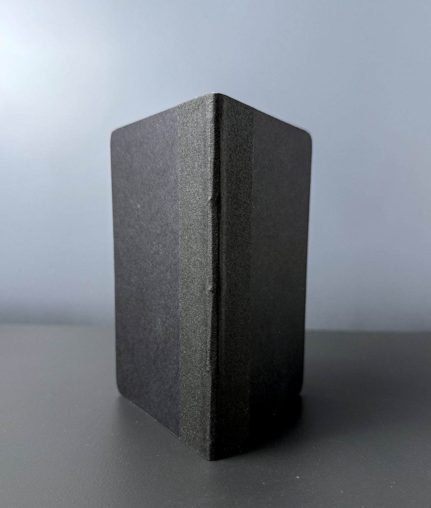The spine of a pocket notebook 